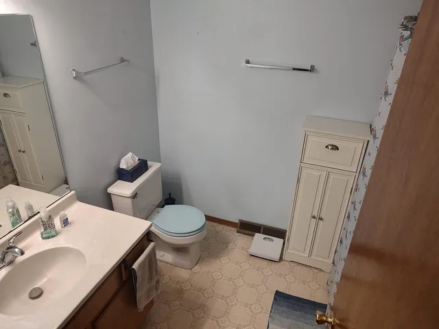 a view of a hallway with seating area