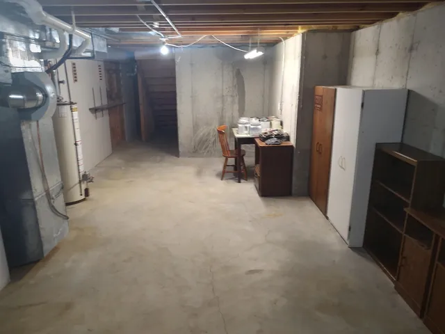 a view of a house with wooden fence