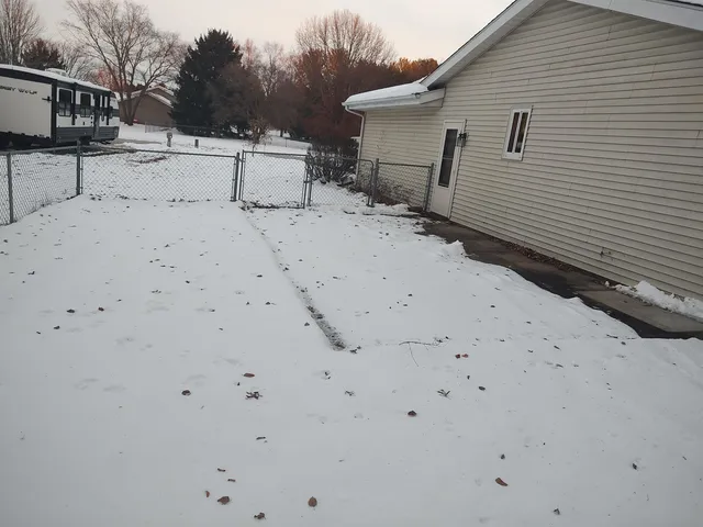 a view of a house with backyard space