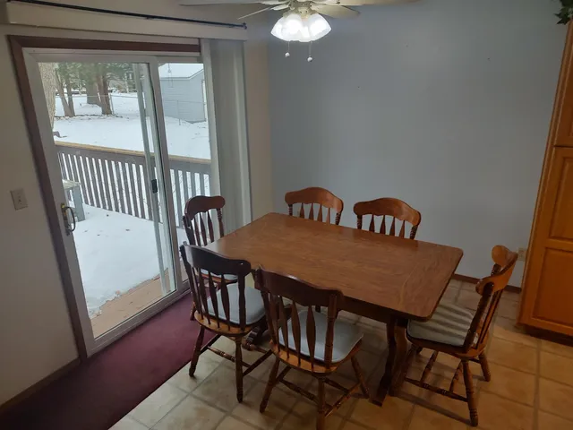 a view of a livingroom with furniture and a fireplace