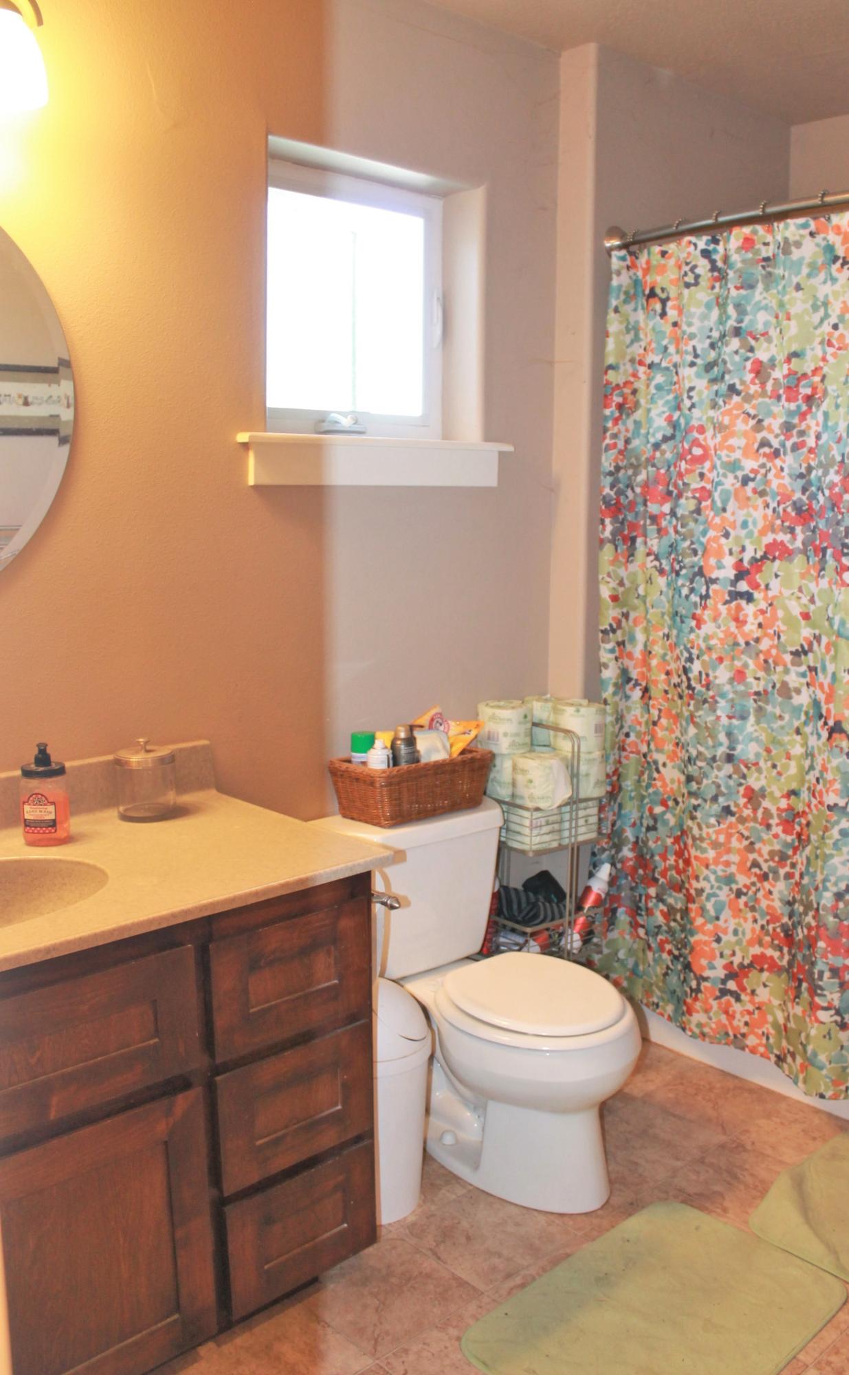 10990 Agate Road Eagle Point, OR 97524 - Photo 20 of 28 a bathroom with a granite countertop toilet sink and mirror