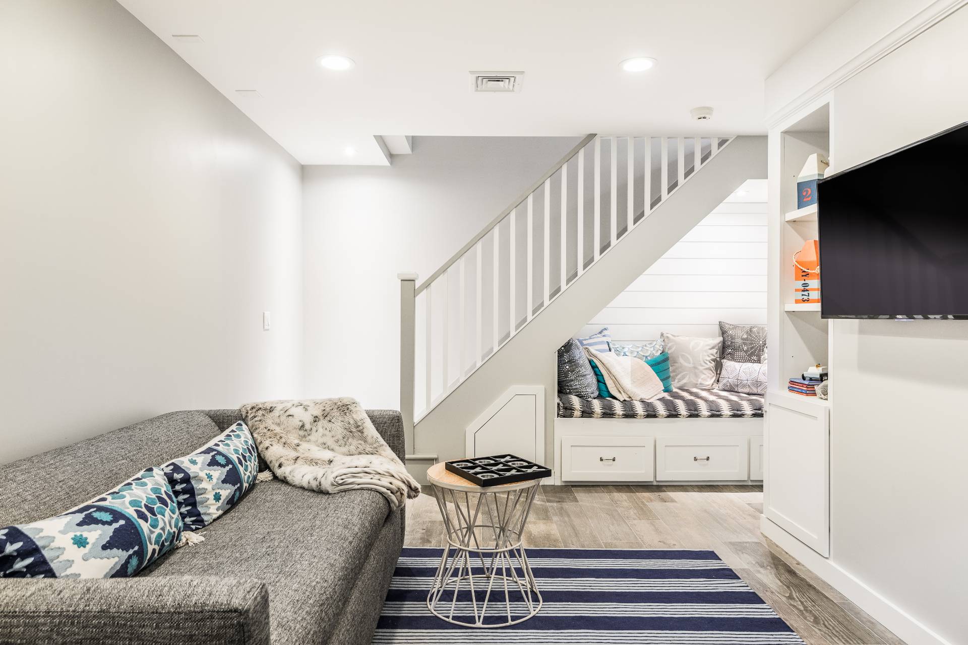 93 Wainscott NW Road Wainscott, NY 11975 - Photo 14 of 24 a living room with furniture and a flat screen tv