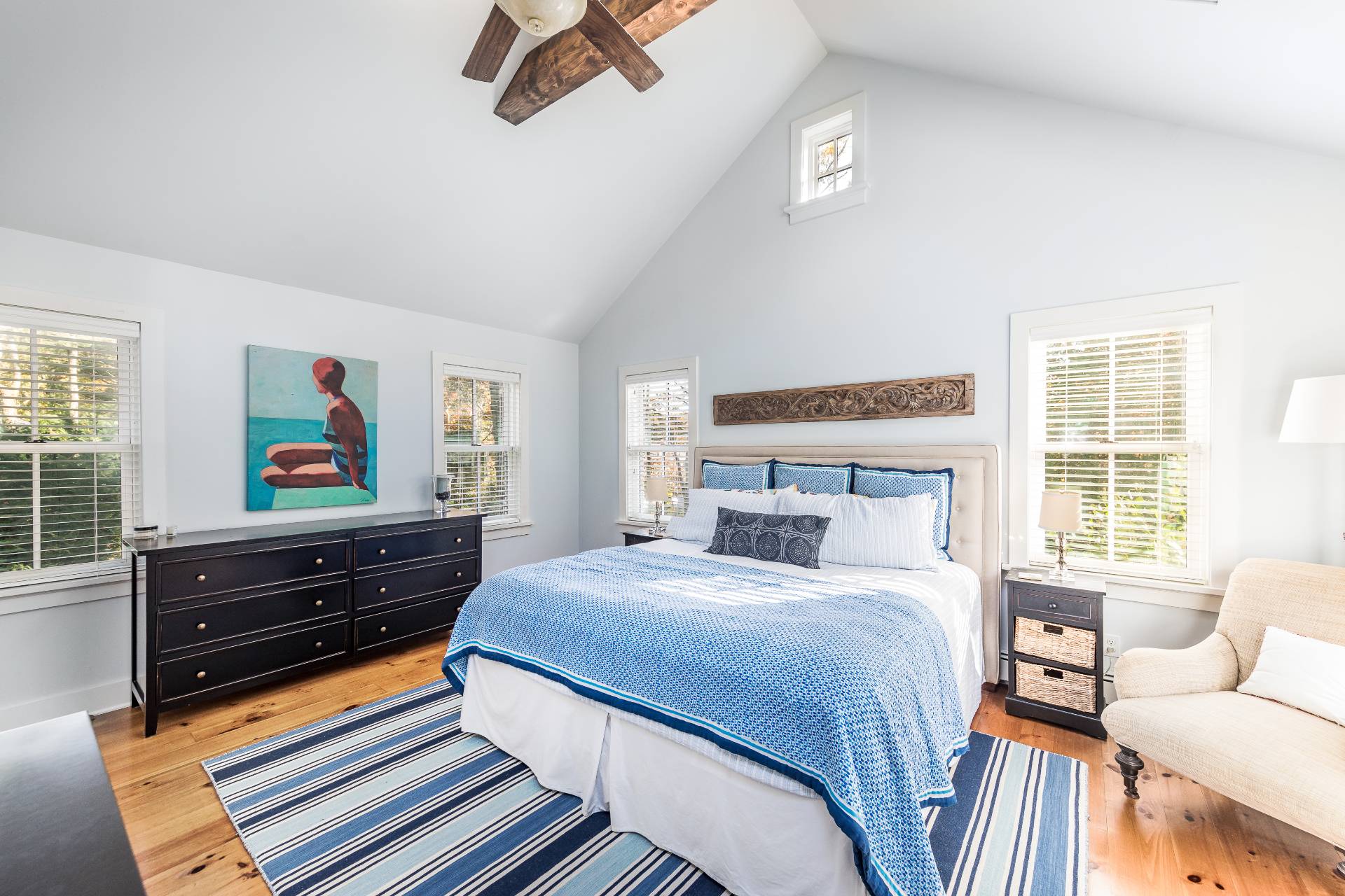 93 Wainscott NW Road Wainscott, NY 11975 - Photo 16 of 24 a bedroom with a bed and wooden floor