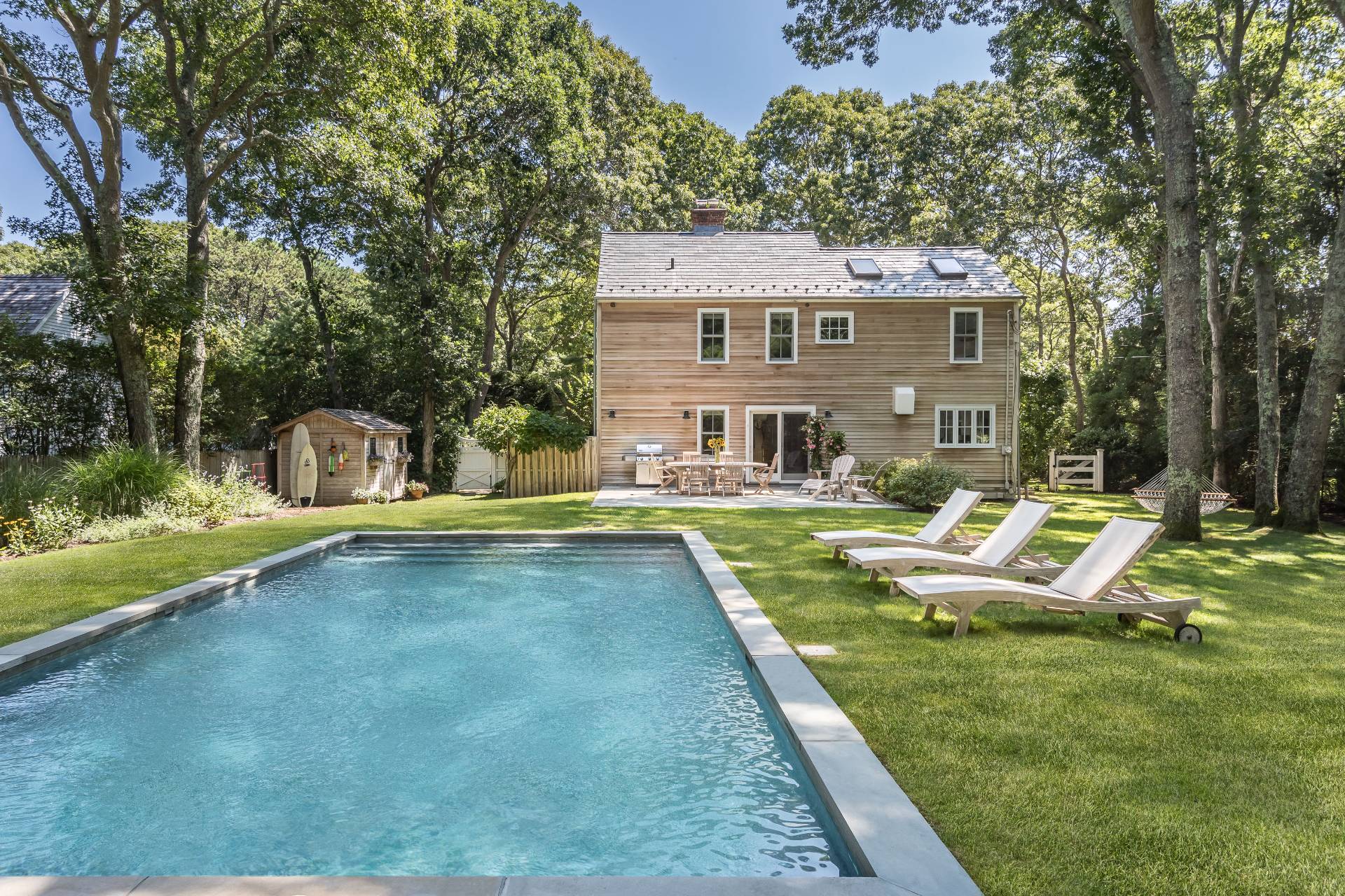 93 Wainscott NW Road Wainscott, NY 11975 - Photo 2 of 24 a view of a house with swimming pool and sitting area