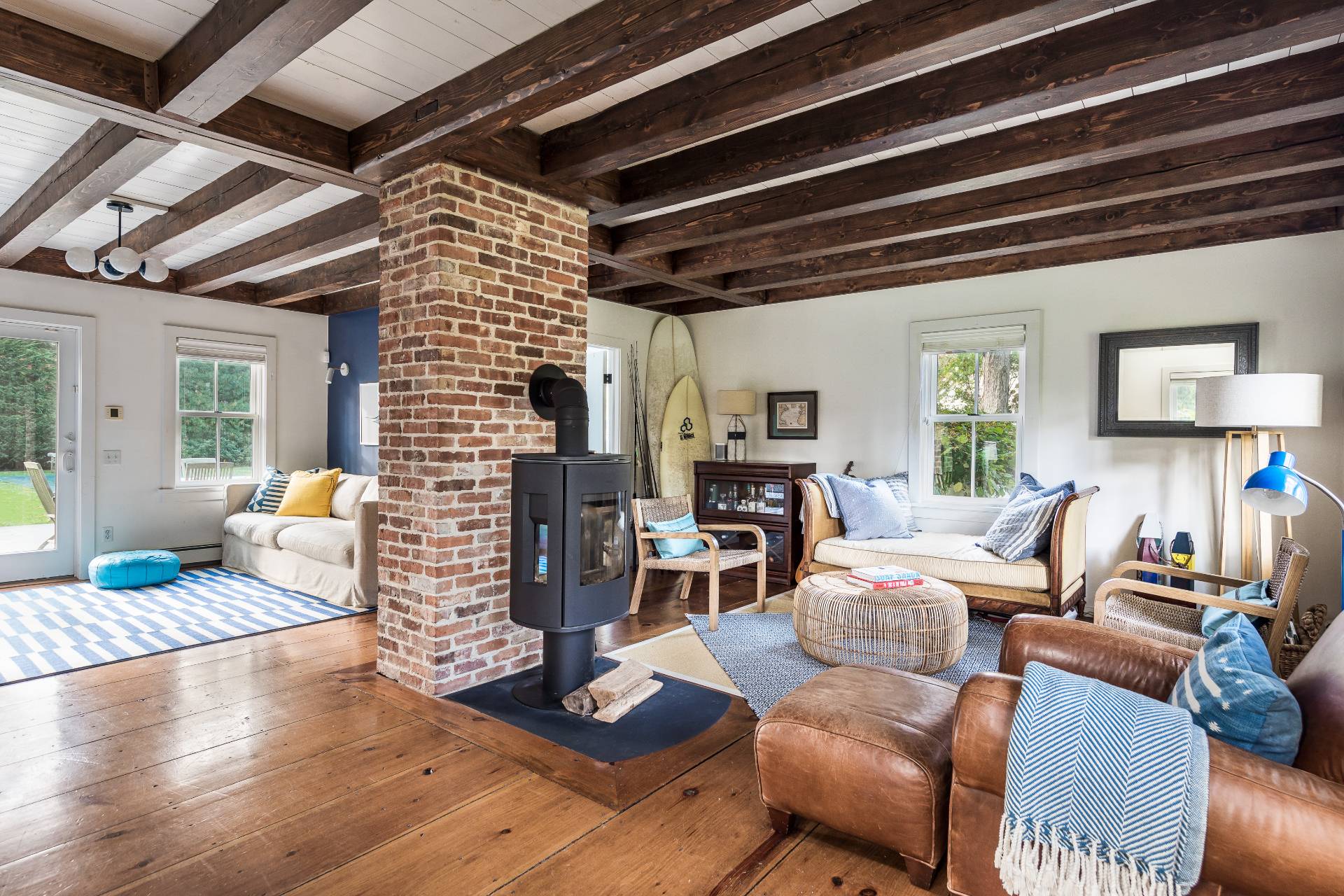 93 Wainscott NW Road Wainscott, NY 11975 - Photo 6 of 24 a living room with furniture and a fireplace