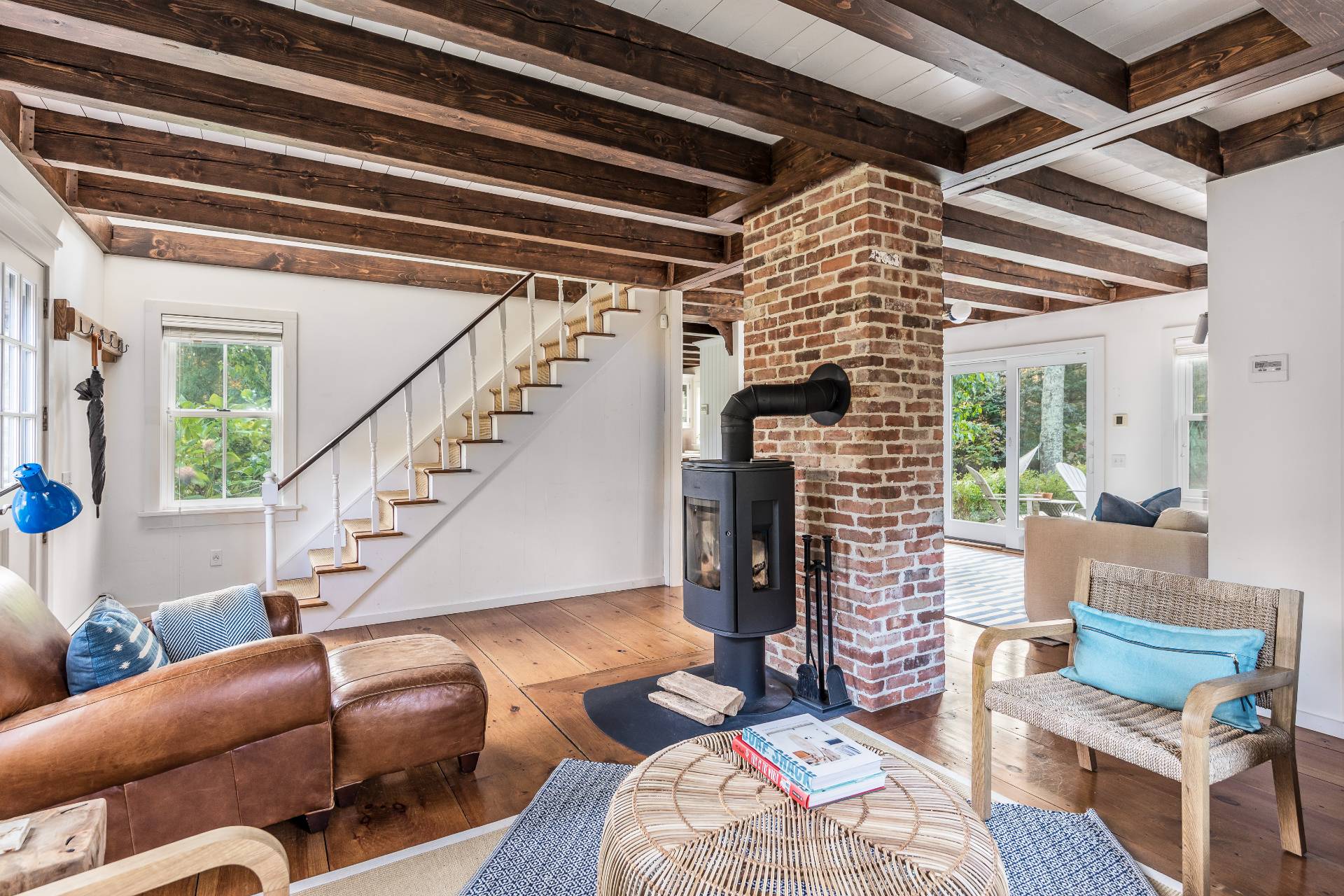 93 Wainscott NW Road Wainscott, NY 11975 - Photo 8 of 24 a living room with furniture and a potted plant