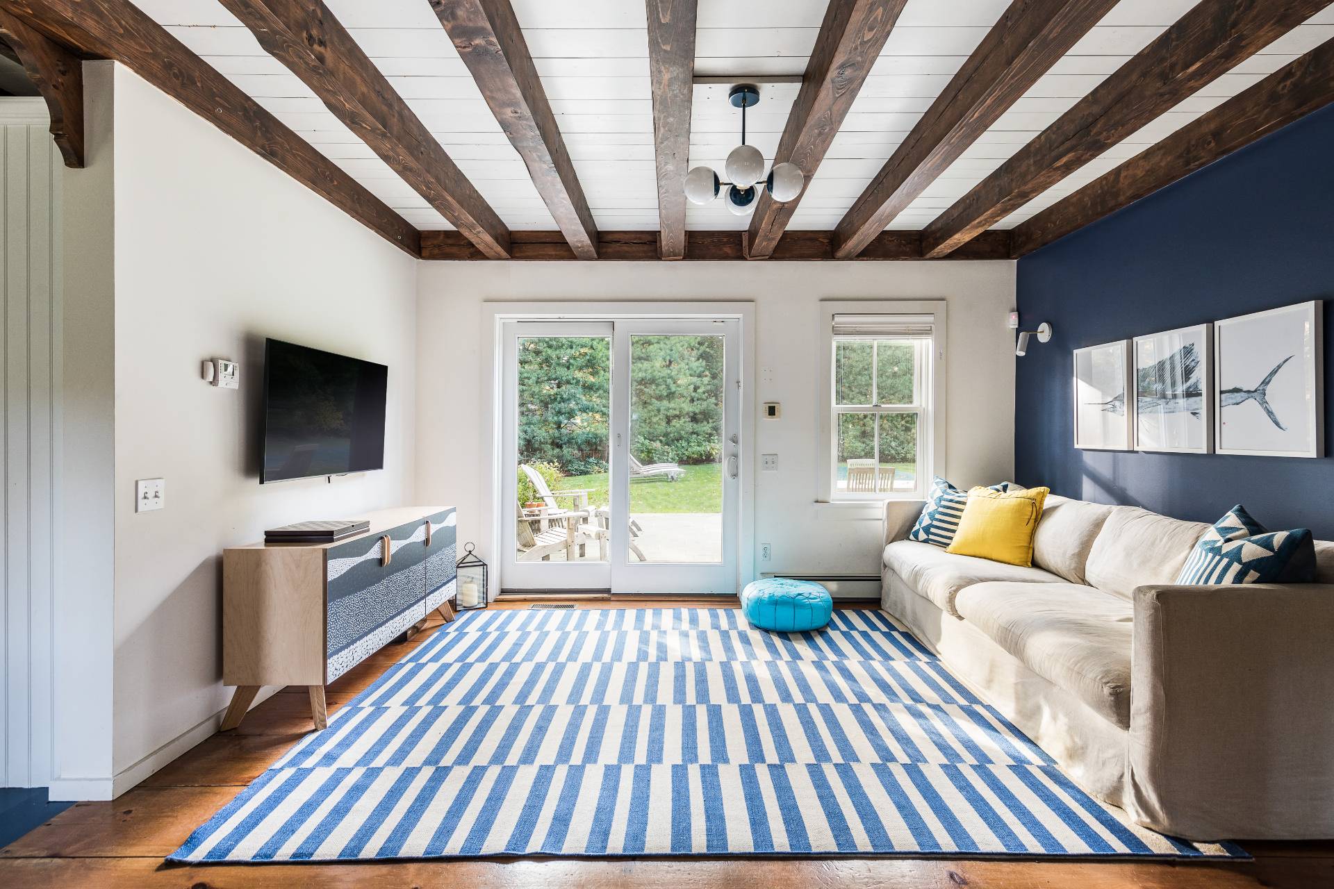 93 Wainscott NW Road Wainscott, NY 11975 - Photo 10 of 24 a living room with furniture and a flat screen tv