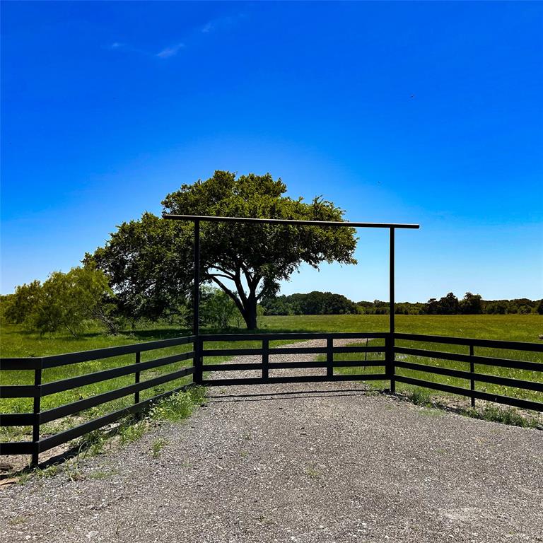 Tbd Southwest Tbd Sw 2250th Road Dawson, TX 76639 - Photo 2 of 21 a view of a garden with a bench in the back yard
