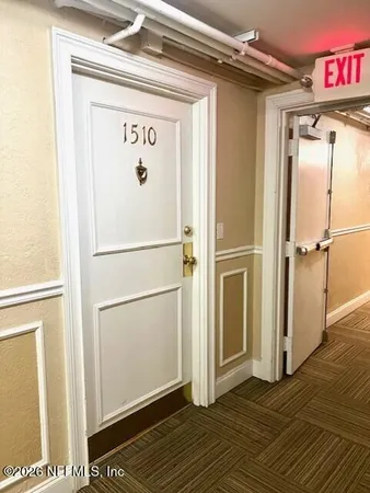 a view of a refrigerator in kitchen and wooden floor