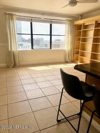 a view of an empty room with a window