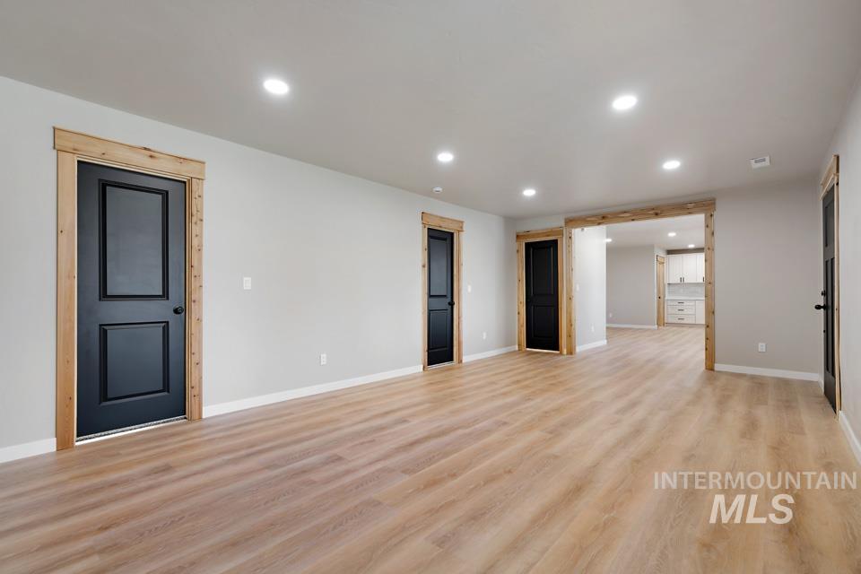 535 Day Road Weiser, ID 83672 - Photo 11 of 44 Unfurnished living room with light wood-style floors and recessed lighting