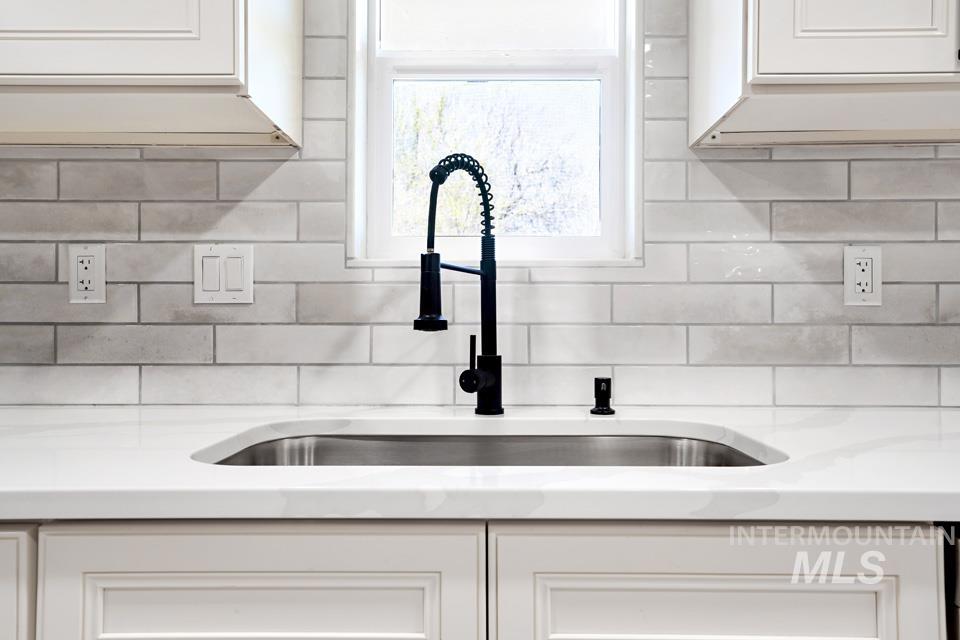 535 Day Road Weiser, ID 83672 - Photo 14 of 44 Kitchen view of white cabinets and light stone counters