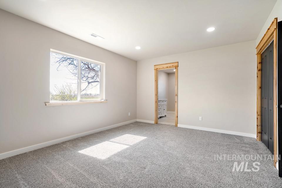 535 Day Road Weiser, ID 83672 - Photo 23 of 44 Unfurnished bedroom featuring light colored carpet and recessed lighting