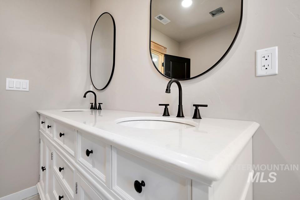 535 Day Road Weiser, ID 83672 - Photo 27 of 44 Full bathroom featuring double vanity and baseboards