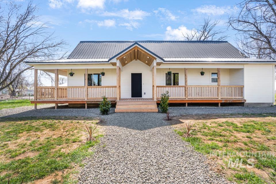 535 Day Road Weiser, ID 83672 - Photo 34 of 44 View of front of house with covered porch and a metal roof