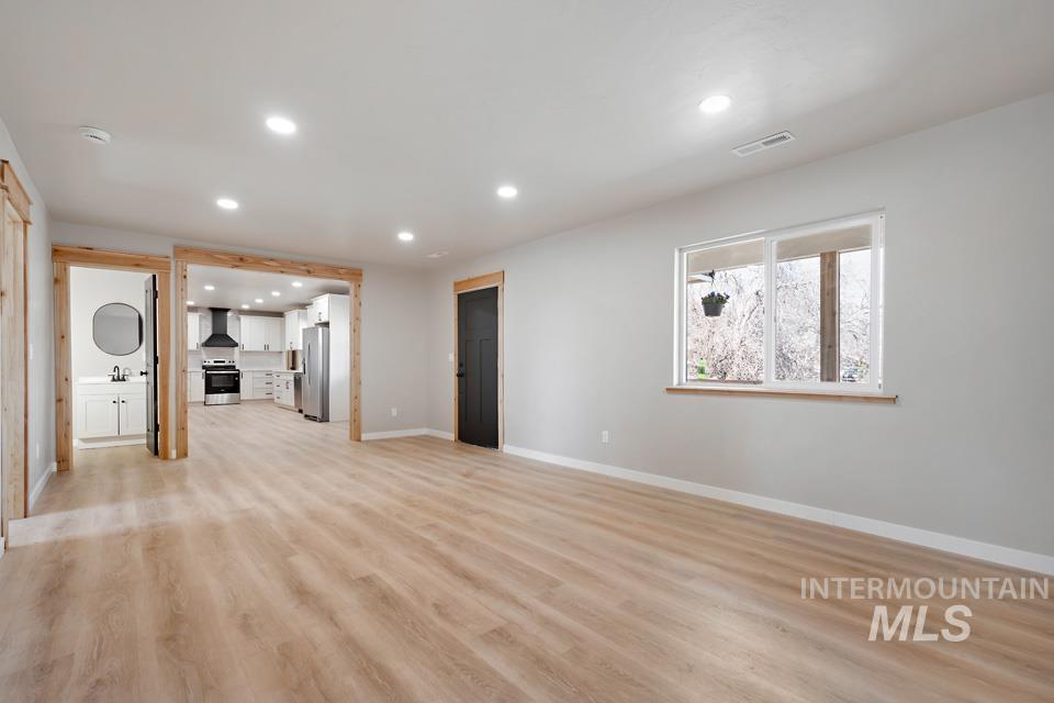 535 Day Road Weiser, ID 83672 - Photo 5 of 44 Unfurnished living room featuring light wood finished floors and recessed lighting