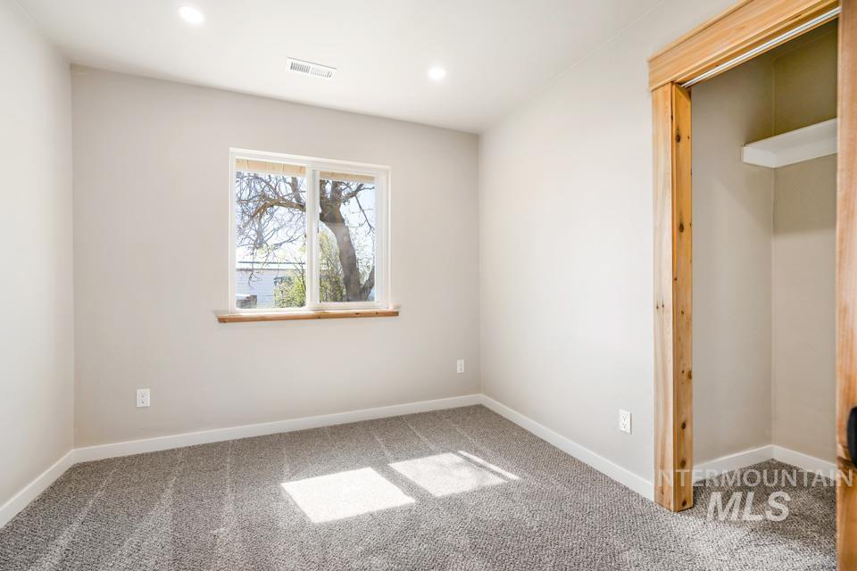 535 Day Road Weiser, ID 83672 - Photo 7 of 44 Unfurnished bedroom featuring recessed lighting and light carpet