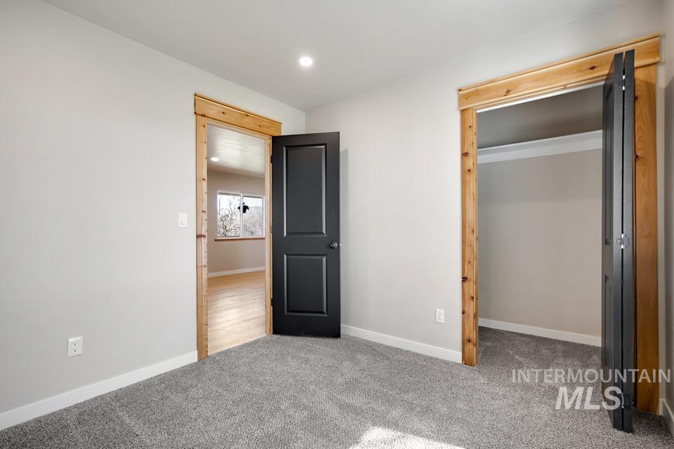 535 Day Road Weiser, ID 83672 - Photo 9 of 44 Unfurnished bedroom with light colored carpet and recessed lighting