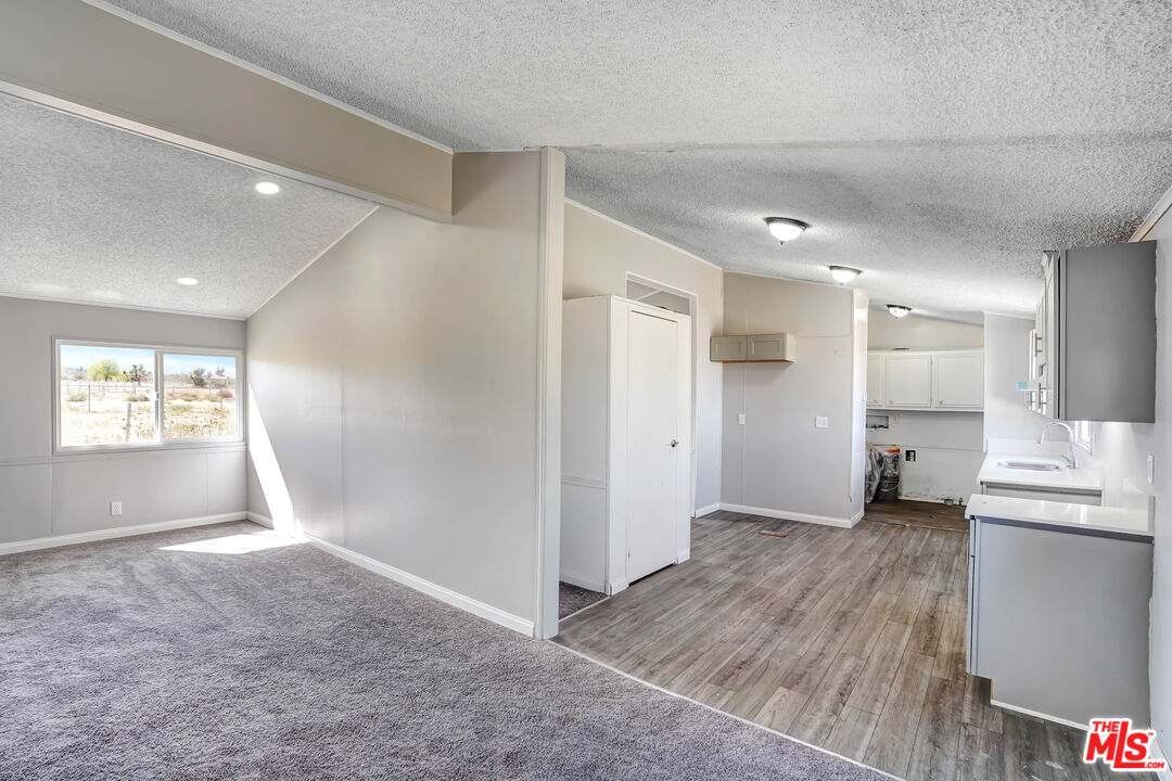 11351 Eaby Road Phelan, CA 92371 - Photo 4 of 23 a view of empty room with wooden floor