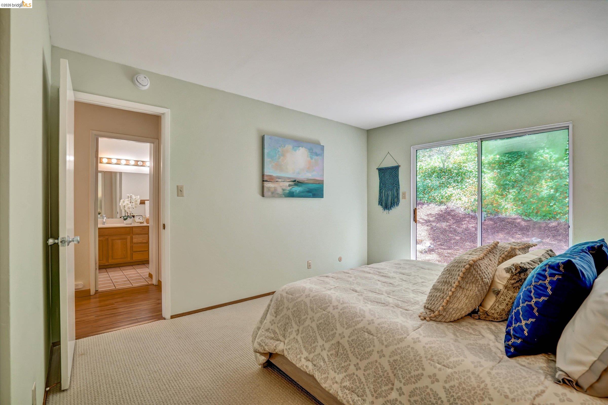 2826 Wright Avenue Pinole, CA 94564 - Photo 28 of 70 Bedroom featuring sliding glass door access to outdoor space, light-colored carpeting, and a neutral wall color