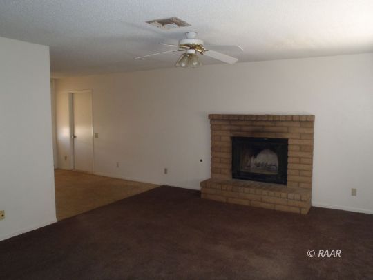 733 Commercial Ridgecrest, CA 93555 - Photo 9 of 15 an empty room with a fireplace