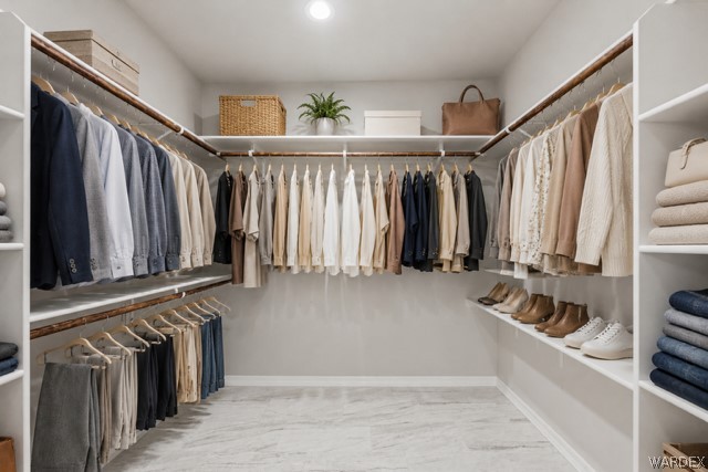9818 North Cyrus Road Kingman, AZ 86401 - Photo 22 of 42 a view of walk in closet with clothes and shoes