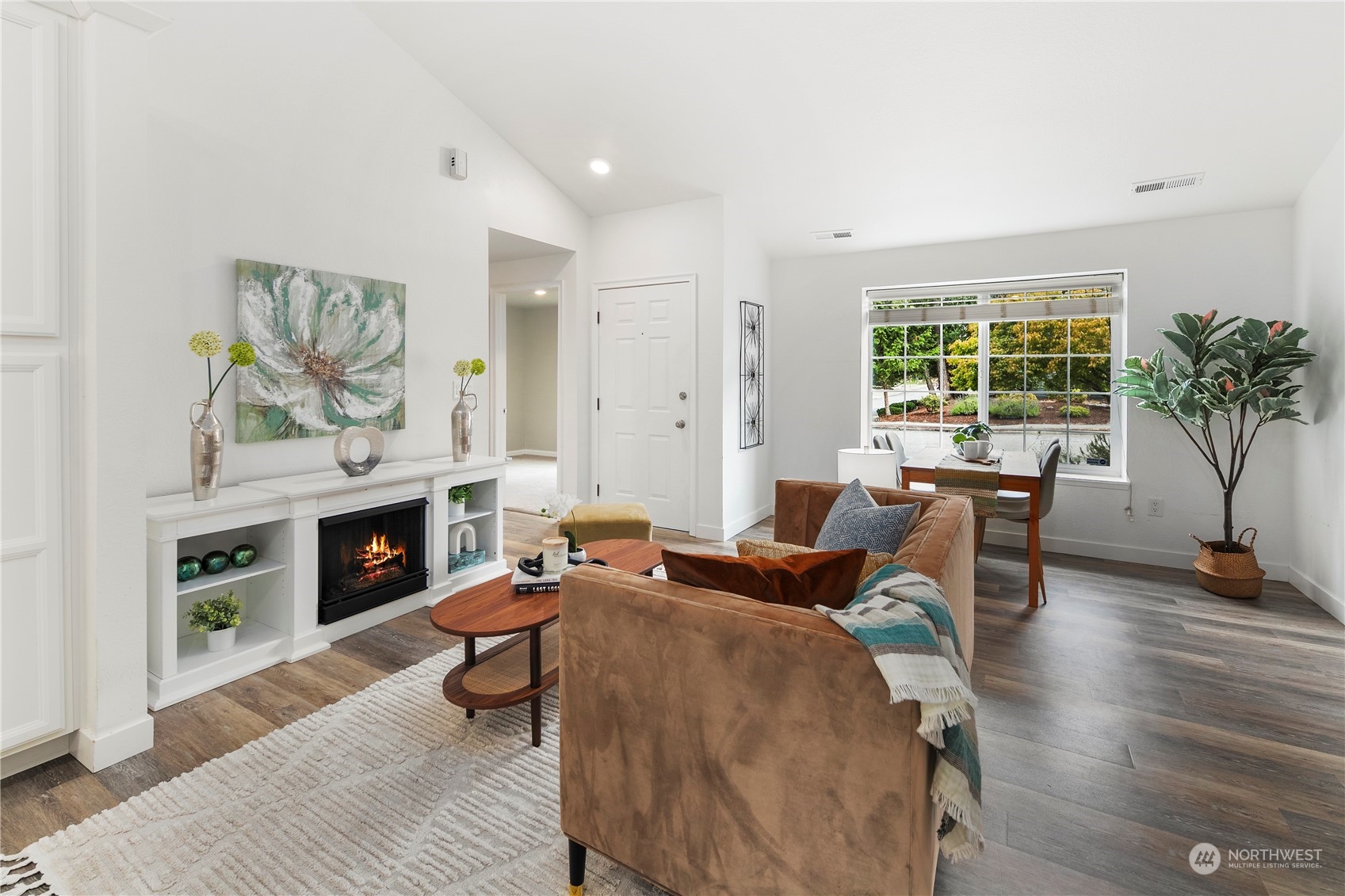 2207 Northeast 23rd Street Renton, WA 98056 - Photo 13 of 34 a living room with fireplace furniture and a large window