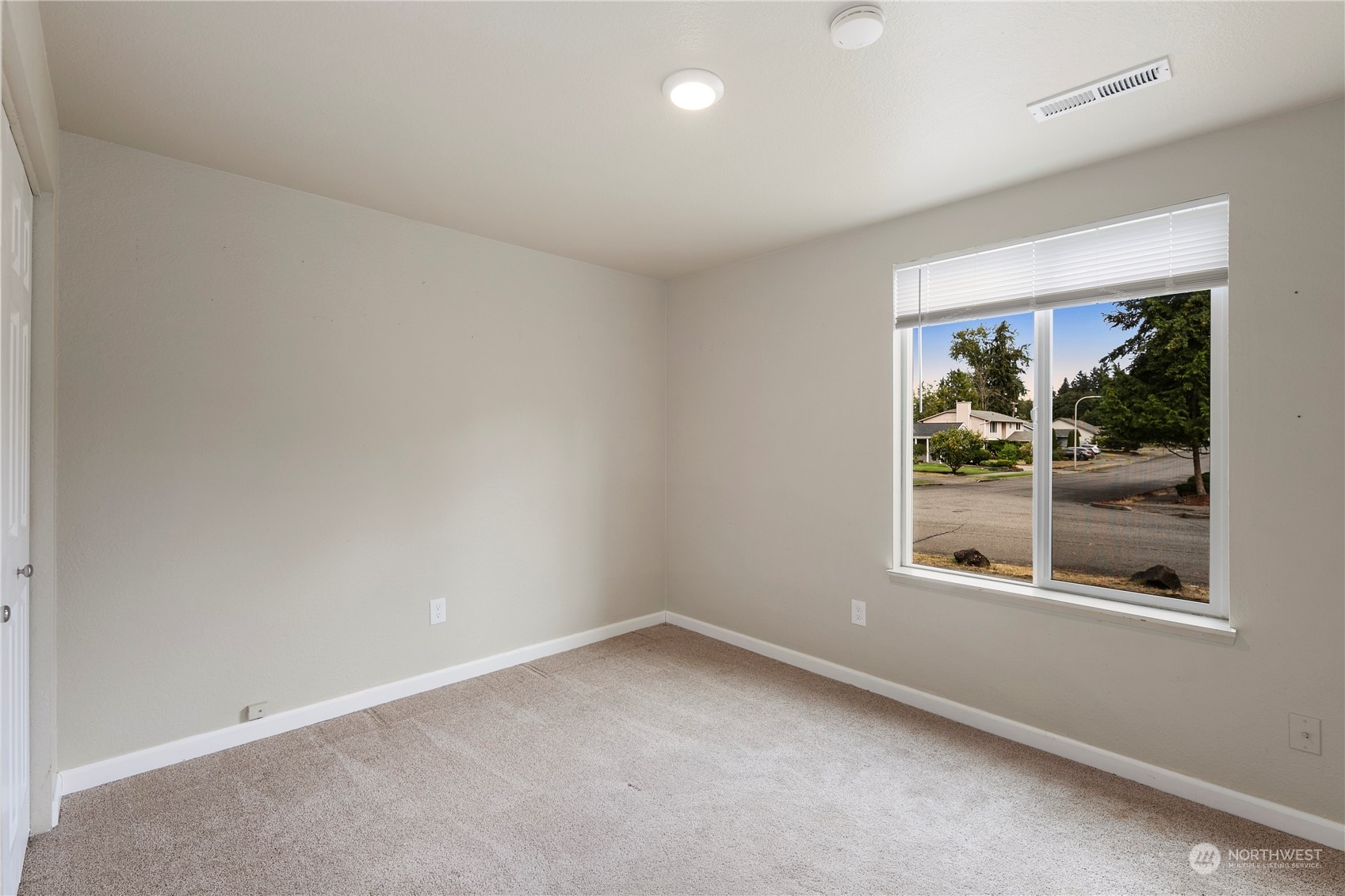 2207 Northeast 23rd Street Renton, WA 98056 - Photo 19 of 34 an empty room with a window