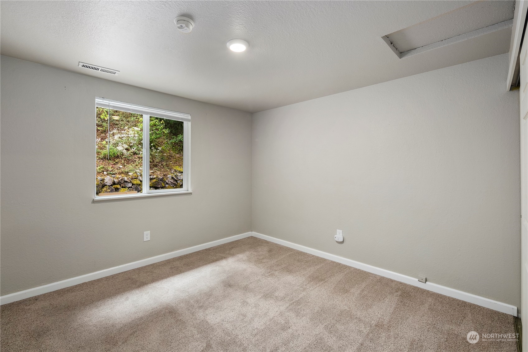 2207 Northeast 23rd Street Renton, WA 98056 - Photo 22 of 34 an empty room with a window