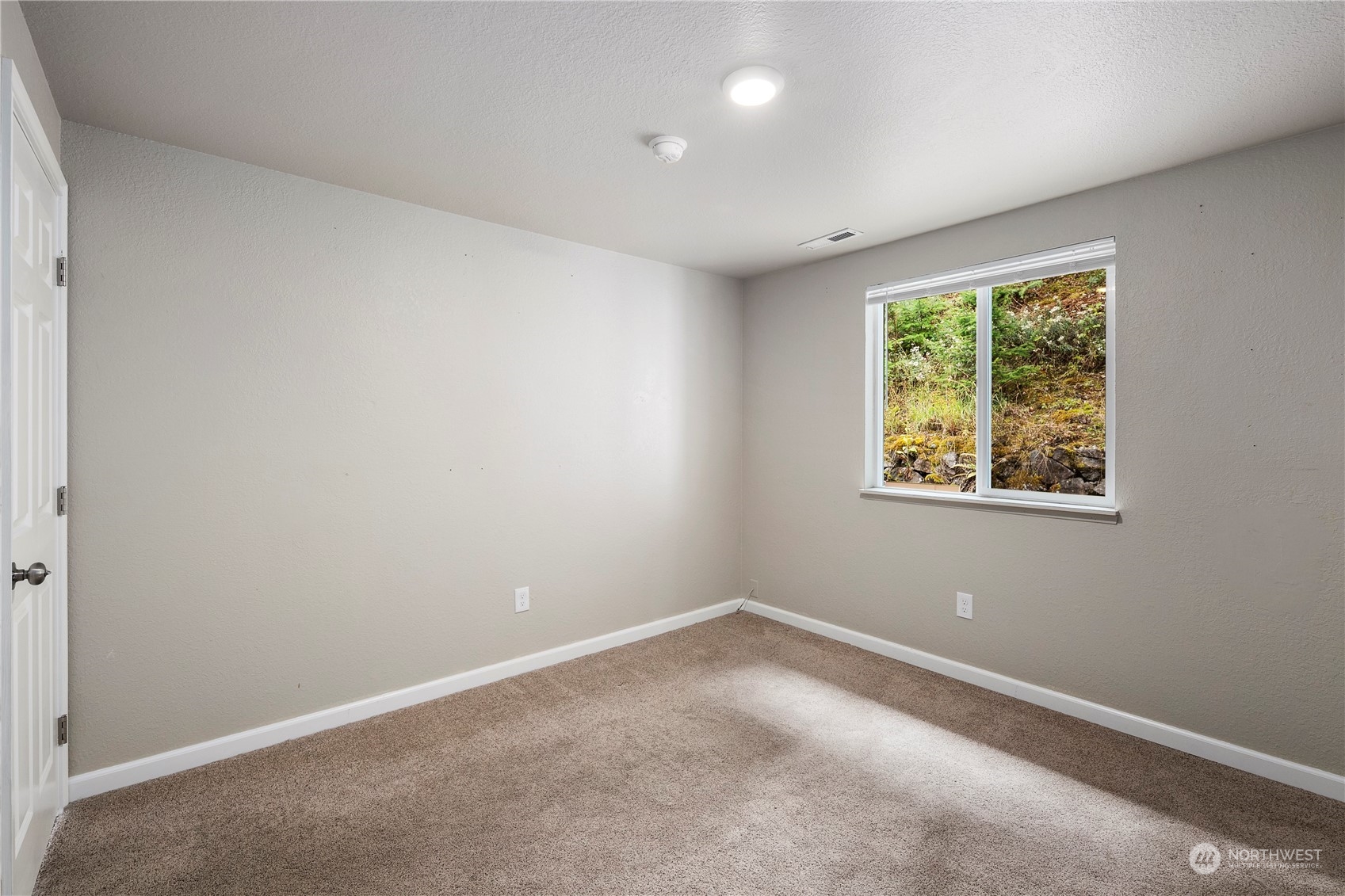 2207 Northeast 23rd Street Renton, WA 98056 - Photo 23 of 34 an empty room with a window