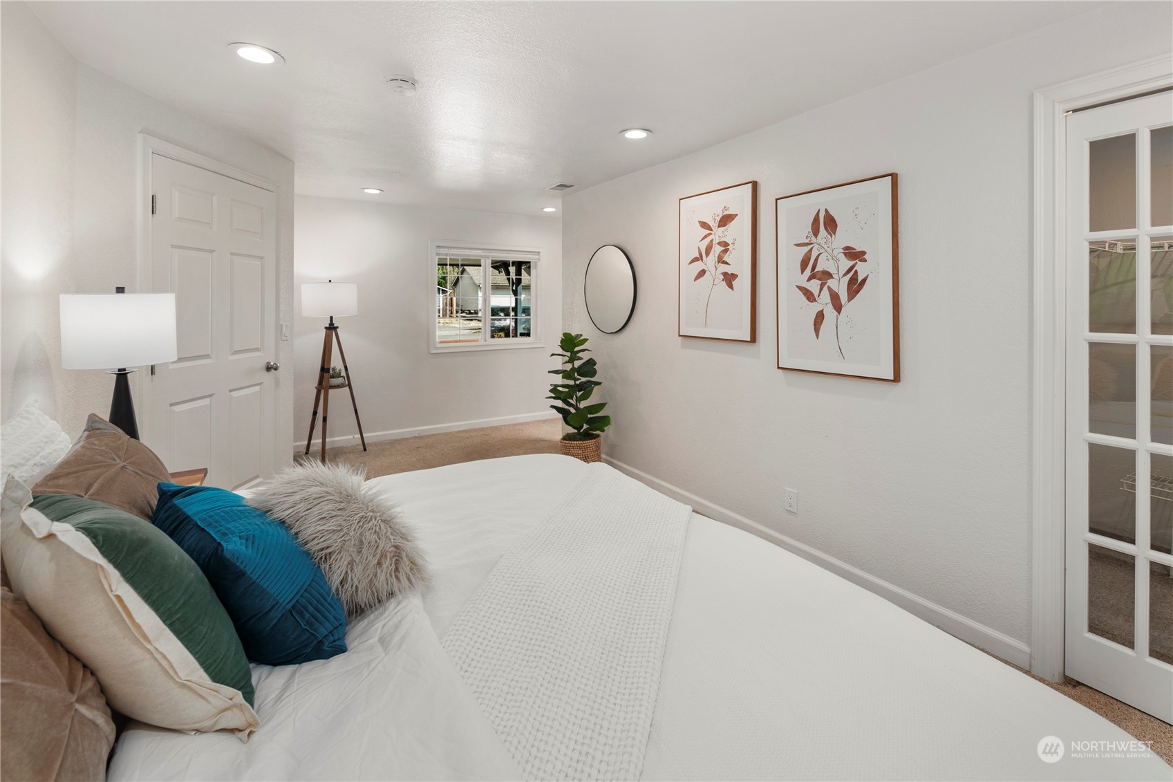 2207 Northeast 23rd Street Renton, WA 98056 - Photo 25 of 34 a bedroom with a bed and painting on the wall