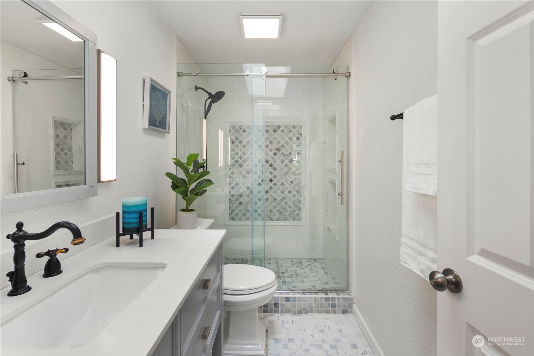 2207 Northeast 23rd Street Renton, WA 98056 - Photo 27 of 34 a bathroom with a sink a toilet and shower