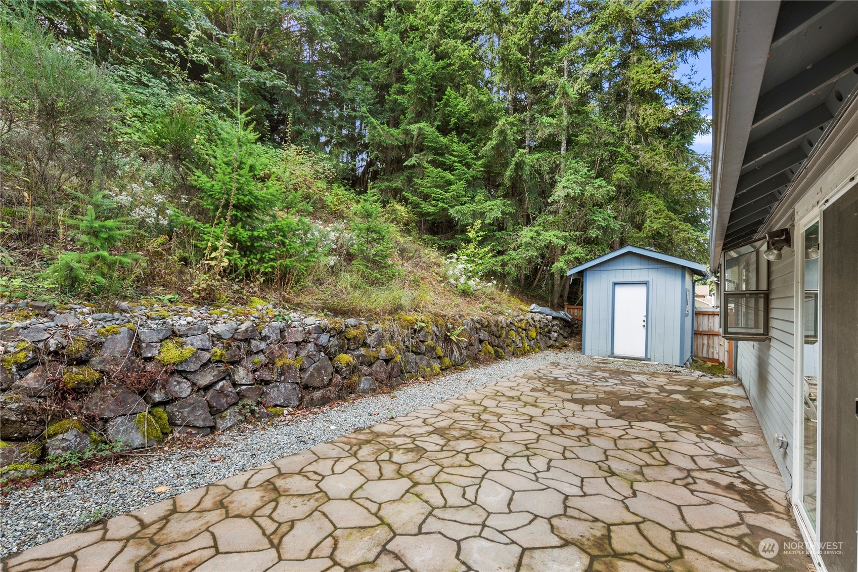 2207 Northeast 23rd Street Renton, WA 98056 - Photo 29 of 34 a view of a house with a small yard and large tree