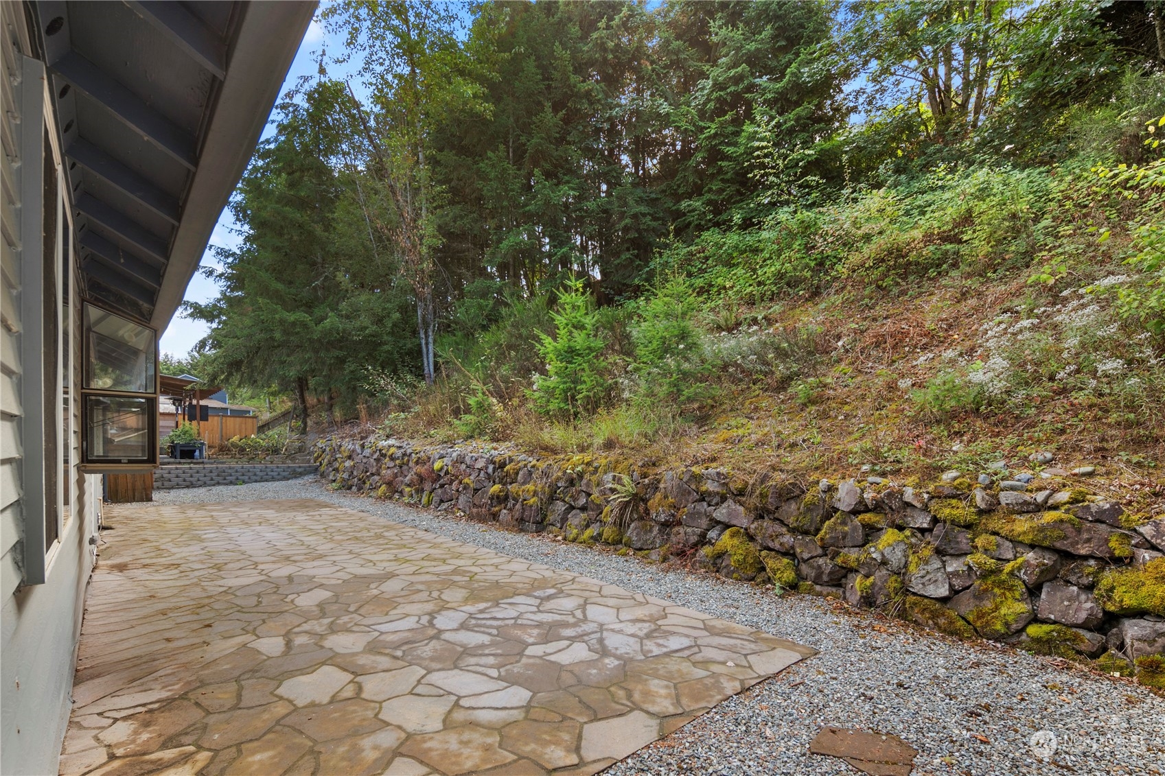 2207 Northeast 23rd Street Renton, WA 98056 - Photo 31 of 34 a view of a yard with plants and trees