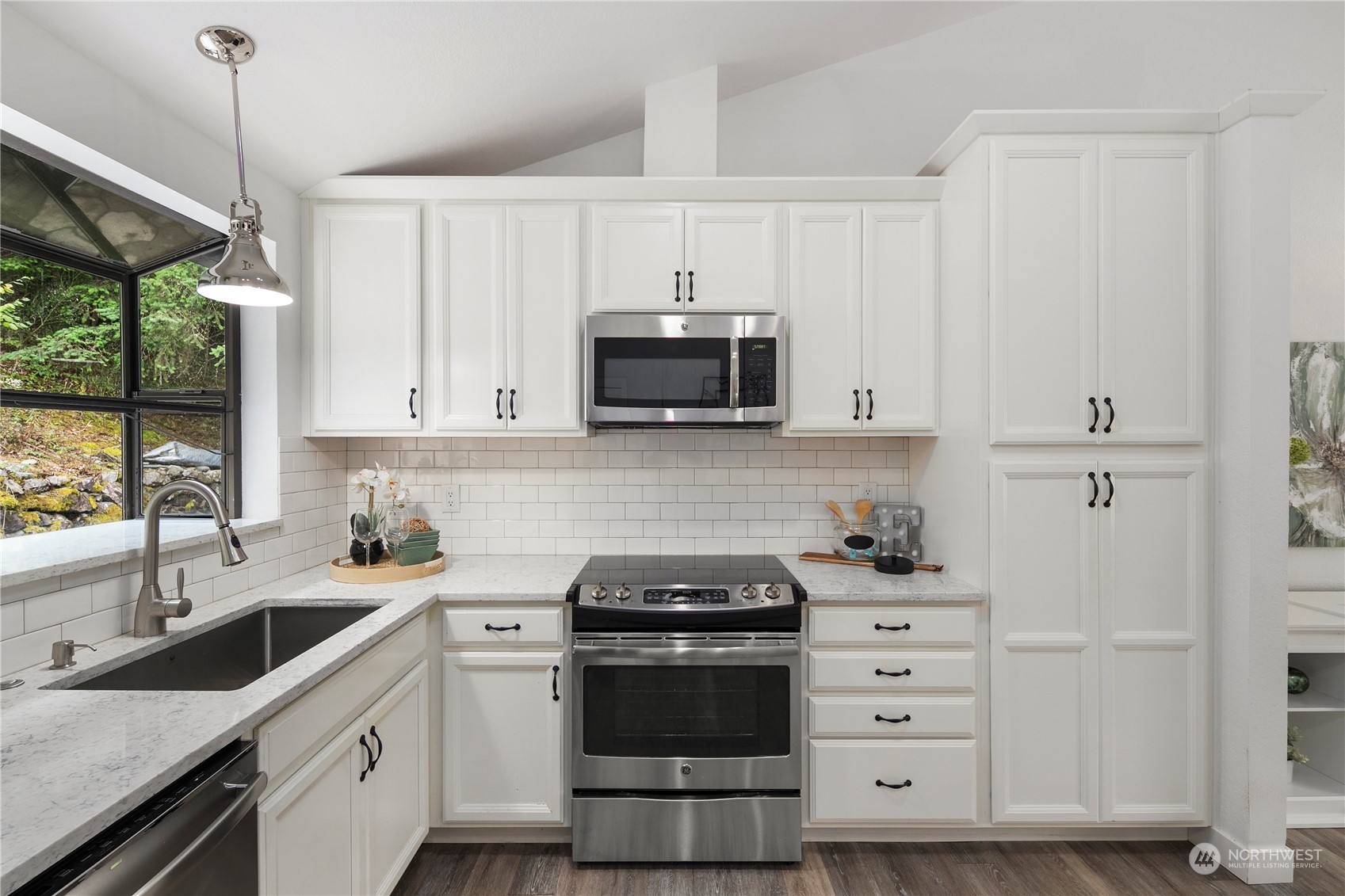 2207 Northeast 23rd Street Renton, WA 98056 - Photo 9 of 34 a kitchen with a stove and a microwave oven