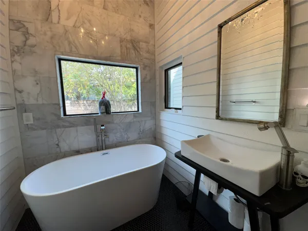 a bathroom with a sink and a bathtub