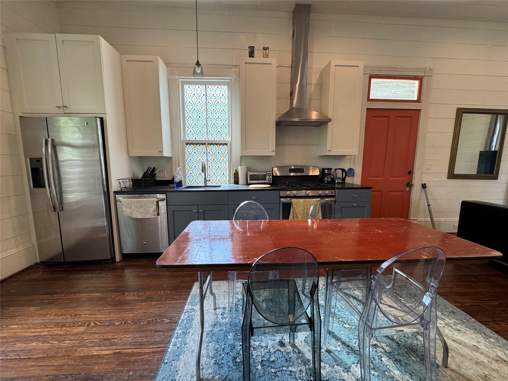 3408 Garrow Street, Unit A Houston, TX 77003 - Photo 20 of 30 a kitchen with stainless steel appliances granite countertop a stove a sink refrigerator and microwave