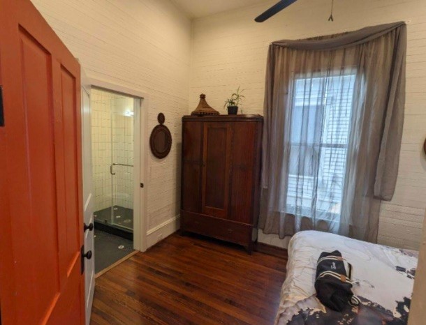3408 Garrow Street, Unit A Houston, TX 77003 - Photo 21 of 30 a view of bedroom with a bed and wooden floor