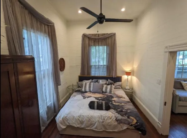 a bedroom with furniture and a window