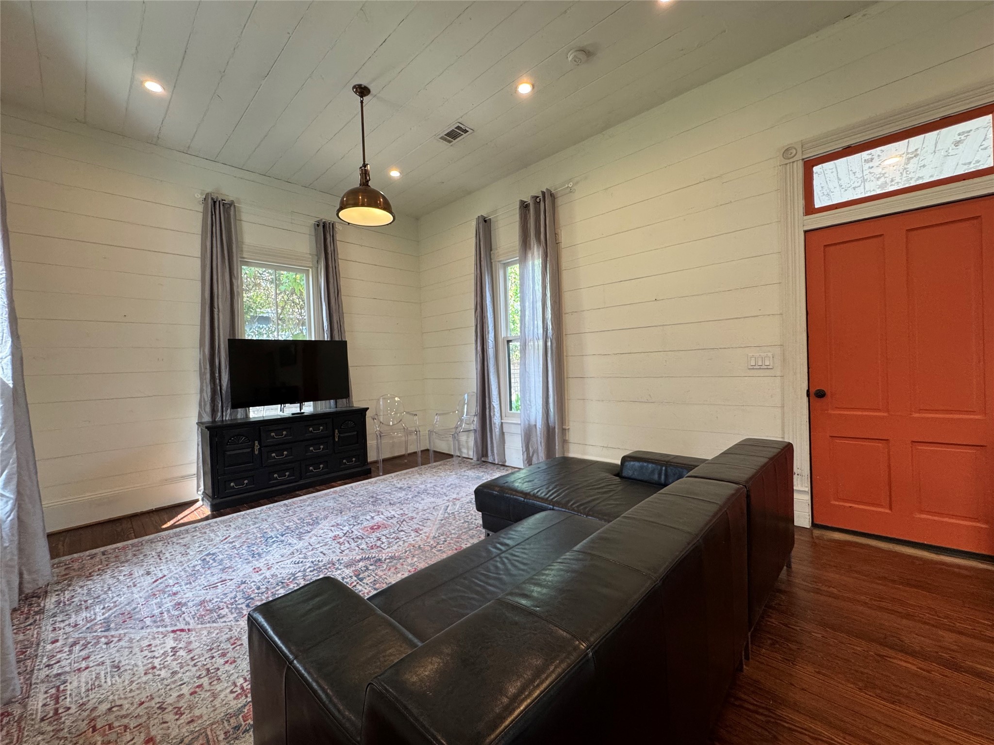 3408 Garrow Street, Unit A Houston, TX 77003 - Photo 26 of 30 a living room with furniture and a flat screen tv
