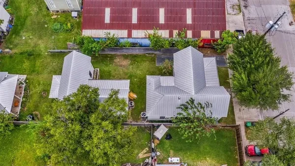 an aerial view of a house with a garden and plants
