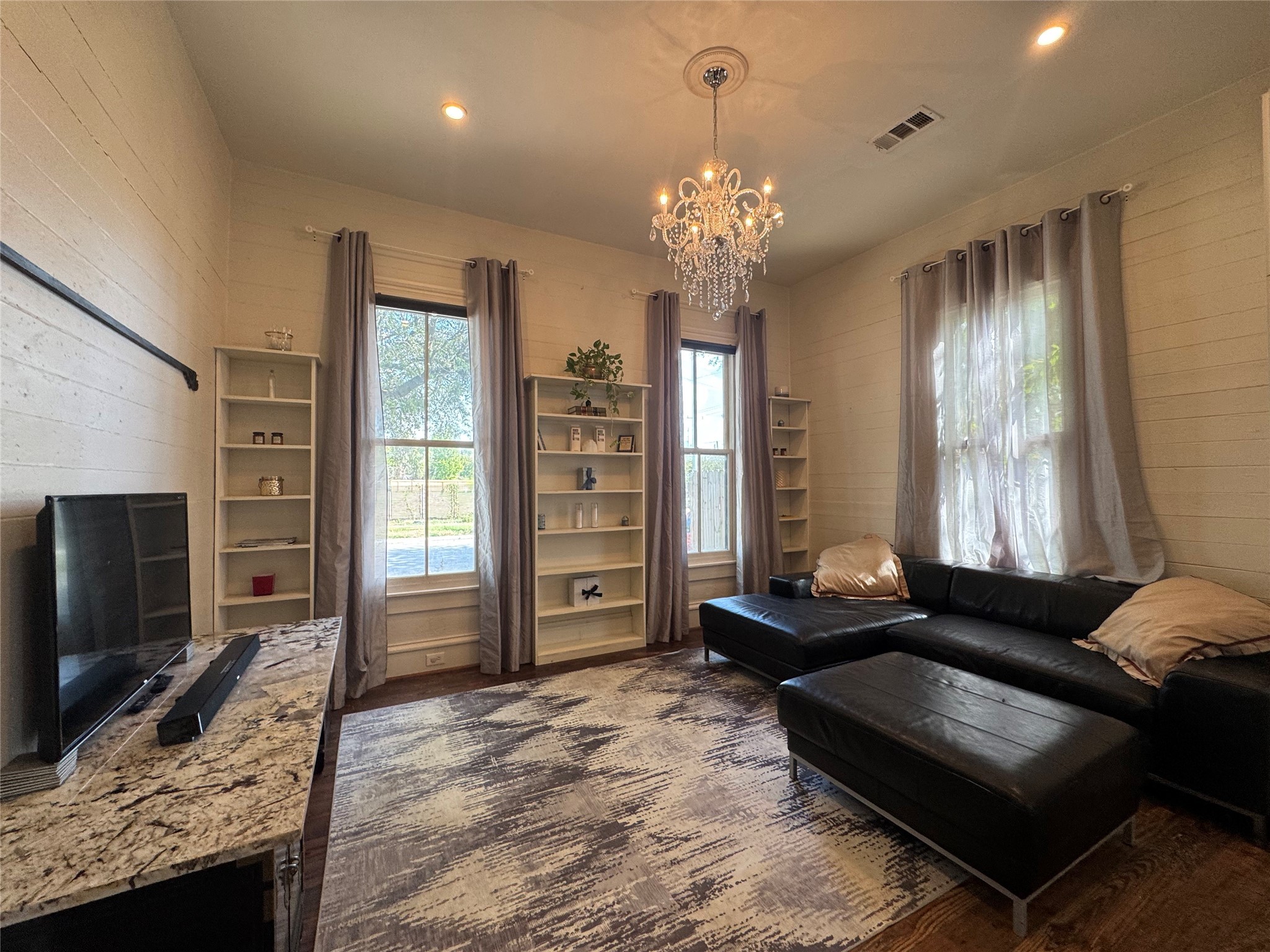 3408 Garrow Street, Unit A Houston, TX 77003 - Photo 5 of 30 a living room with furniture and a flat screen tv