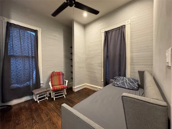 a bedroom with a bed and furniture