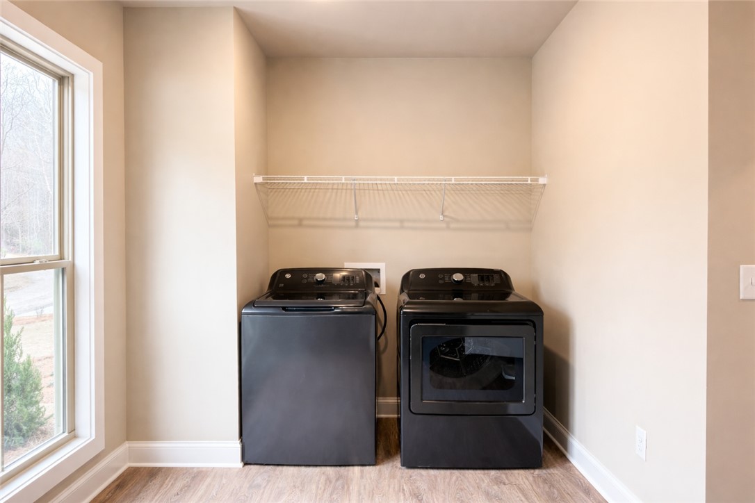 111 Birch Court Westminster, SC 29693 - Photo 12 of 27 This dedicated laundry space combines functionality and natural light for effortless household chores.