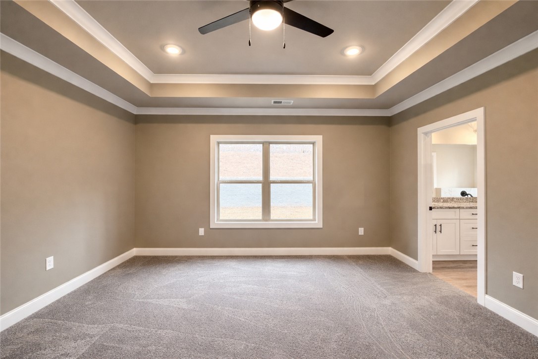 111 Birch Court Westminster, SC 29693 - Photo 14 of 27 This spacious bedroom offers comfortable carpeting and an elegant tray ceiling.