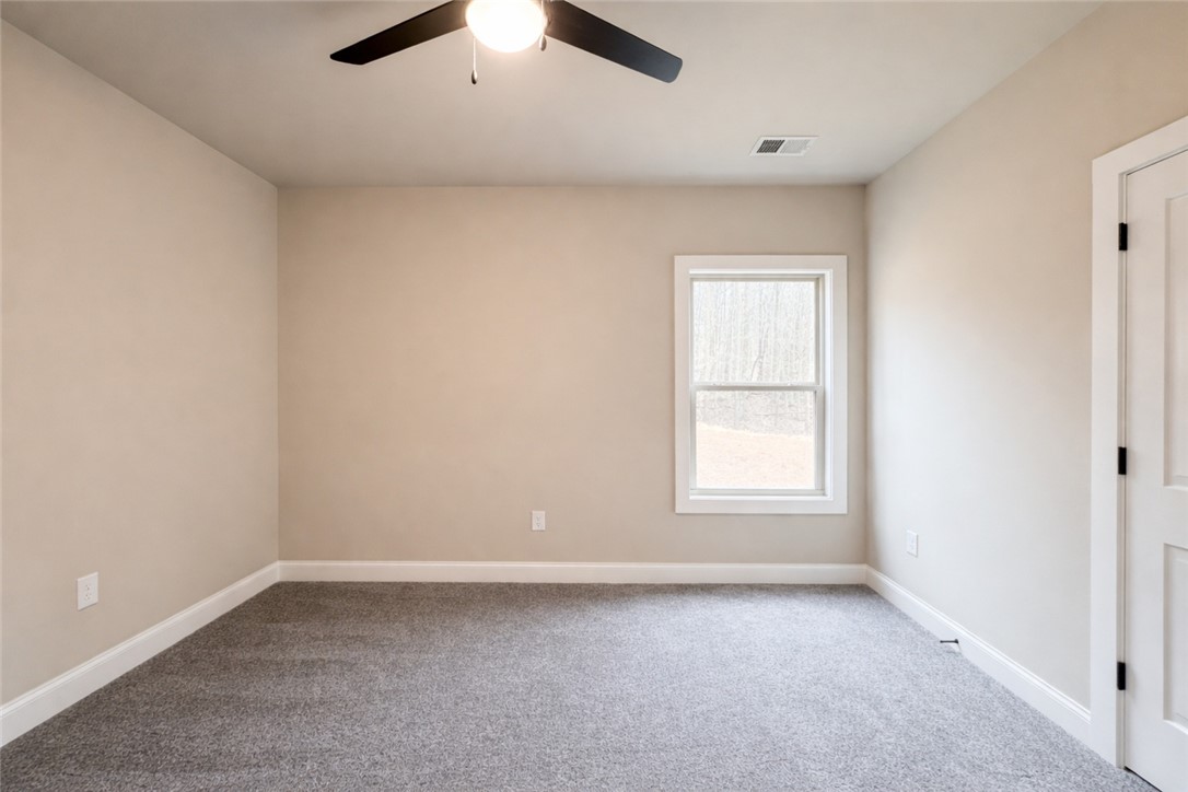 111 Birch Court Westminster, SC 29693 - Photo 22 of 27 This versatile room offers a comfortable ambiance with carpet flooring and ample natural light.
