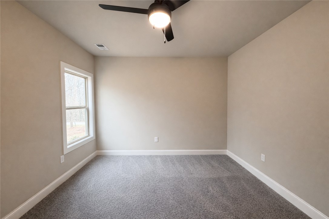 111 Birch Court Westminster, SC 29693 - Photo 23 of 27 This spacious bedroom offers comfortable carpeting and a bright window for abundant natural light.