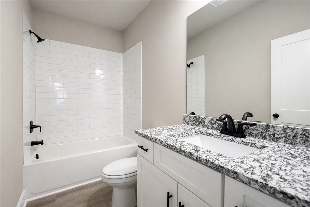 111 Birch Court Westminster, SC 29693 - Photo 25 of 27 This modern bathroom boasts a sleek vanity and a combination tub and shower for ultimate comfort.