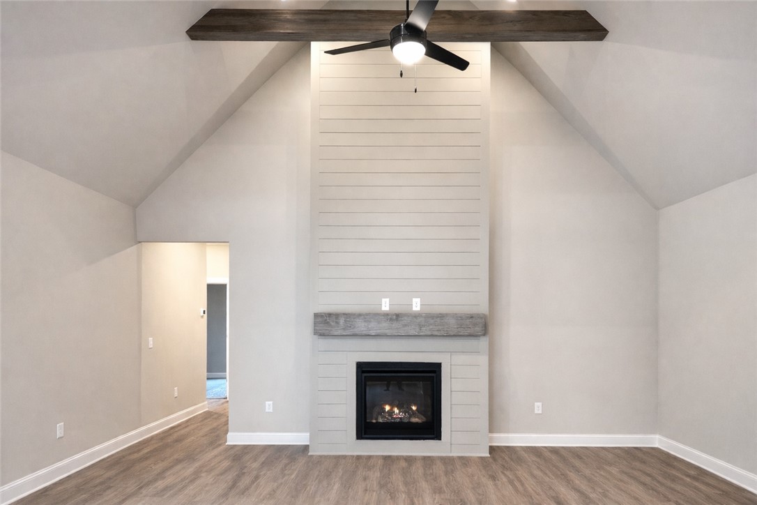 111 Birch Court Westminster, SC 29693 - Photo 4 of 27 This inviting living space features vaulted ceilings and a cozy fireplace, perfect for gatherings.