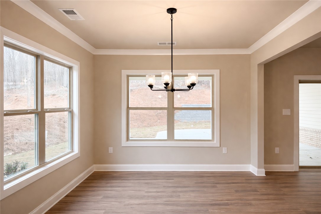 111 Birch Court Westminster, SC 29693 - Photo 6 of 27 This bright space features ample natural light and elegant crown molding.